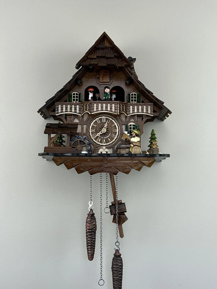 Musical Black Forest Cuckoo Clock 13-Inch with Animated Dancers, Waterwheel, Beer Drinker and Chalet Details by River City Clocks